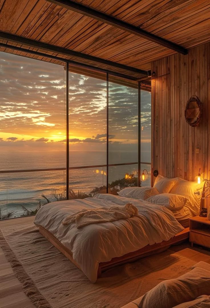 A quiet bedroom with warm evening light and an unmade bed beside a window